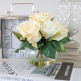 Rose in Water Cream arrangement styled on books with a decorative clock and silver lamp, creating an elegant Hamptons-inspired display.